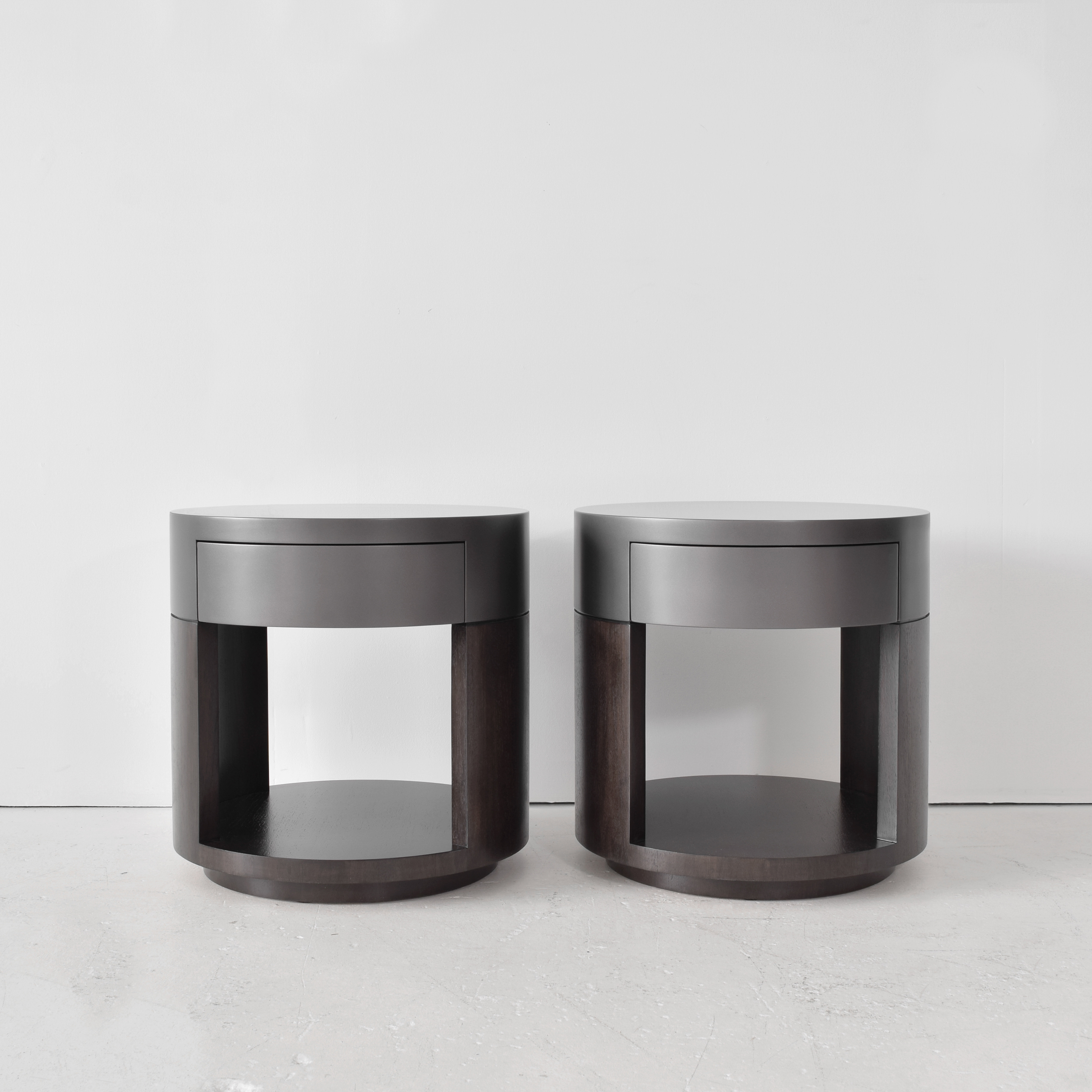 Pair of custom cylindrical nightstands in gunmetal lacquer finish with dark wood tops