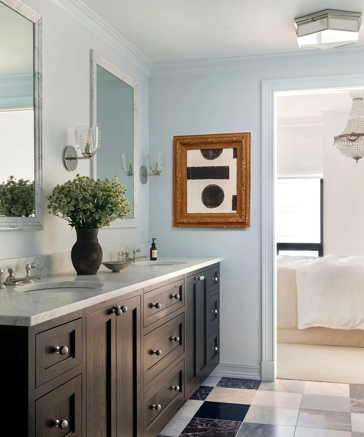 Dark gray charcoal vanity with marble countertop, chrome knob hardware, and plaid tile floor
